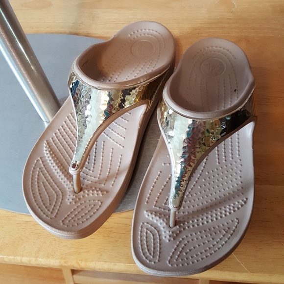 crocs gold flip flops